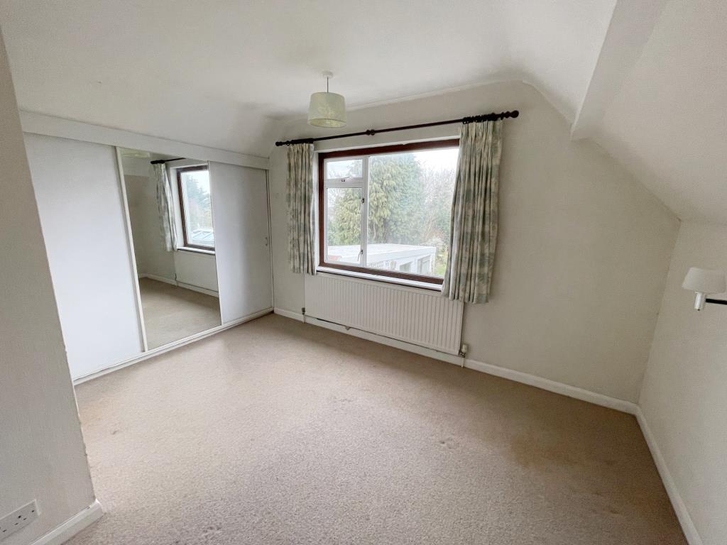 Lot: 63 - A DETACHED THREE-BEDROOM HOUSE SITUATED IN A POPULAR LOCATION FOR IMPROVEMENT - Bedroom 1 with built in cupboards